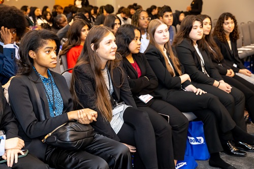 Crowd of students listening to speaker.